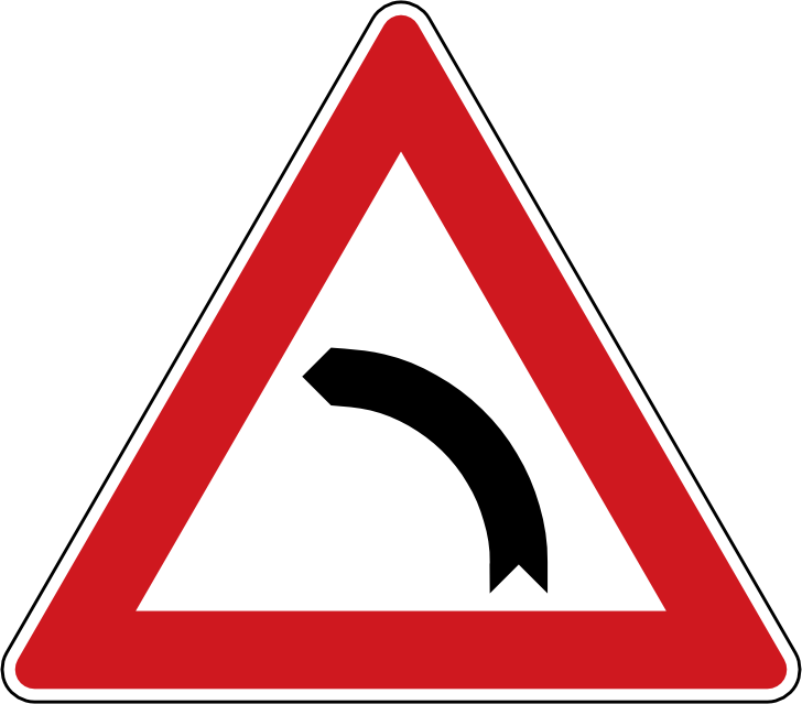 Dopravn znaka Zatka vlevo A 1b. Vstran znaka Zatka vlevo upozoruje na smrov oblouk vlevo.