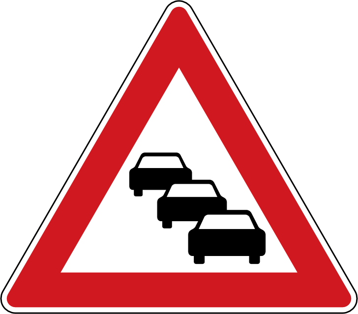 Dopravní značka Kolona A 23. Výstražná značka Kolona upozorňuje na nebezpečí výskytu kolony stojících nebo pomalu jedoucích vozidel.